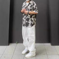 Loose Fitting Casual Straight Leg Cargo Pants With Multiple Pockets And A Drawstring Waist